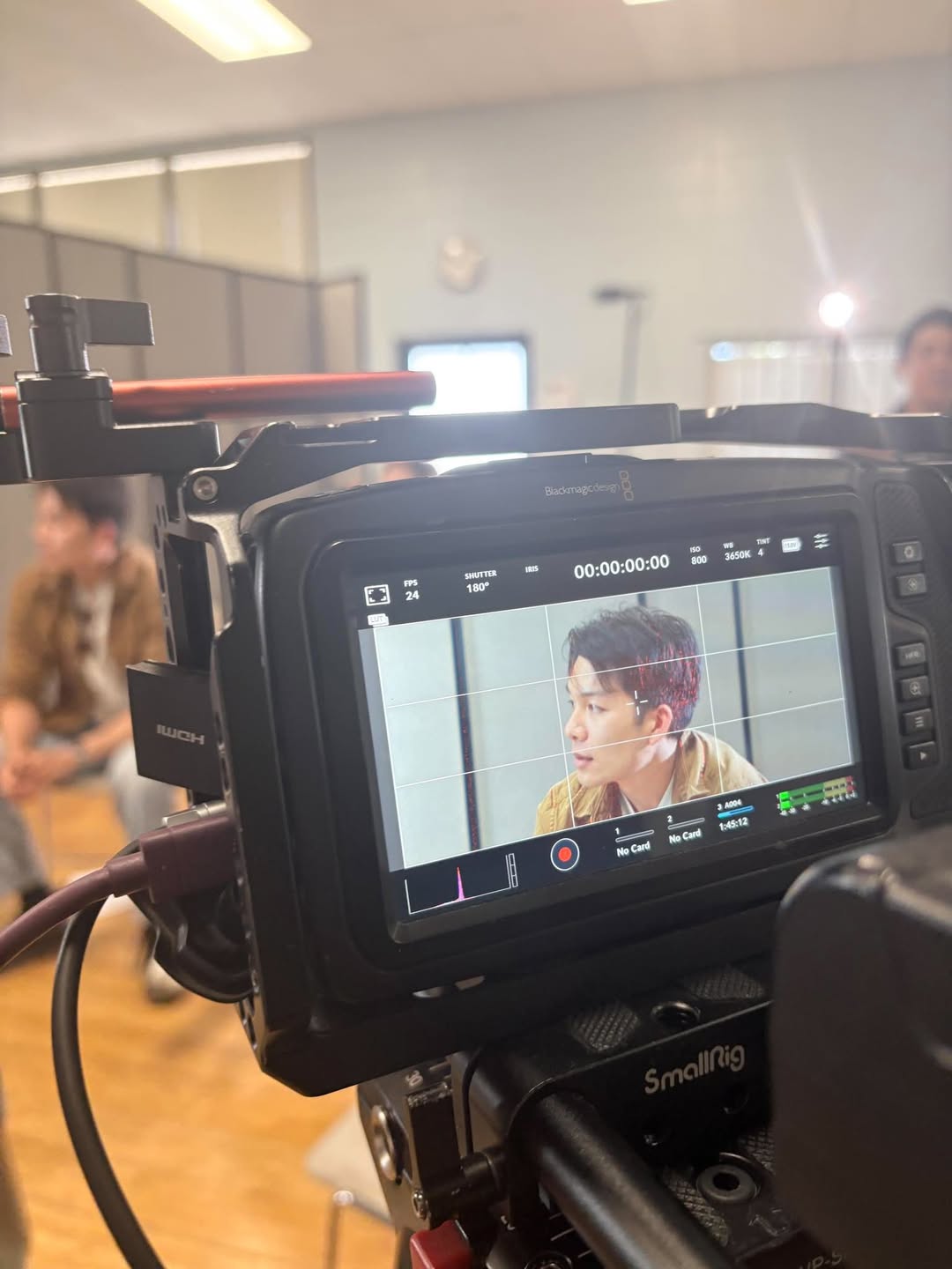 Thomas Tran framed on a Blackmagic camera monitor during a shoot